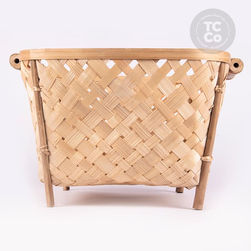 hand-made bamboo basket with legs on white background